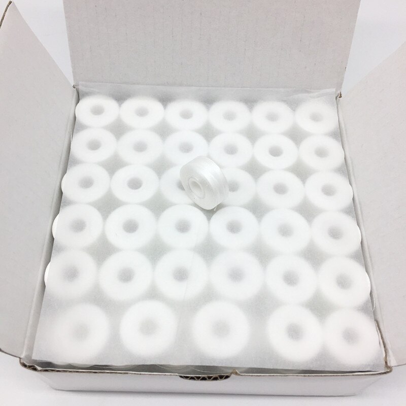 144 st/låda undertråd storlek l vit/svart 75d/2 sidlösa 100%  förlindade polyesterspolar: 75d längder 130 yards