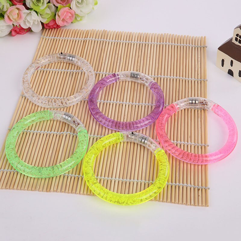 A Goods Spread Out On The Ground For Second Gram Luminescence Bracelet LED Luminescence Children Small Toys