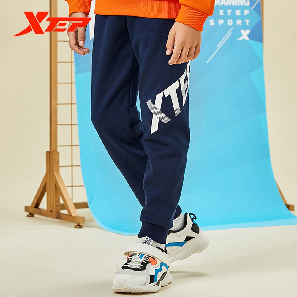 Spodnie dziecięce Xtep 2020 jesienne i zimowe spodnie chłopięce plus kaszmir ciepły tendencja zwykły spodnie sportowe 680426639028