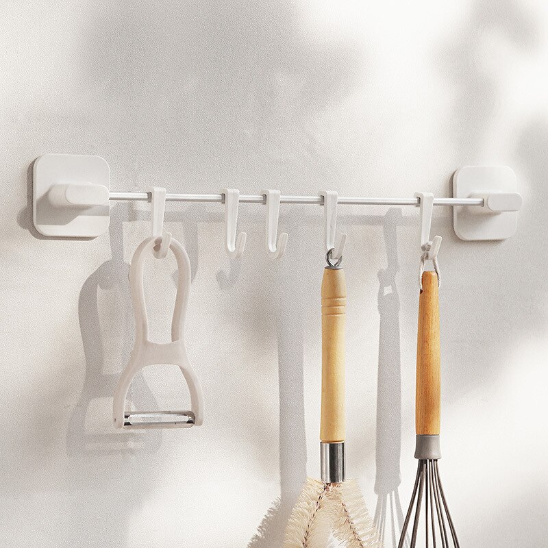A row of hook storage rack on the wall without pun... – Grandado