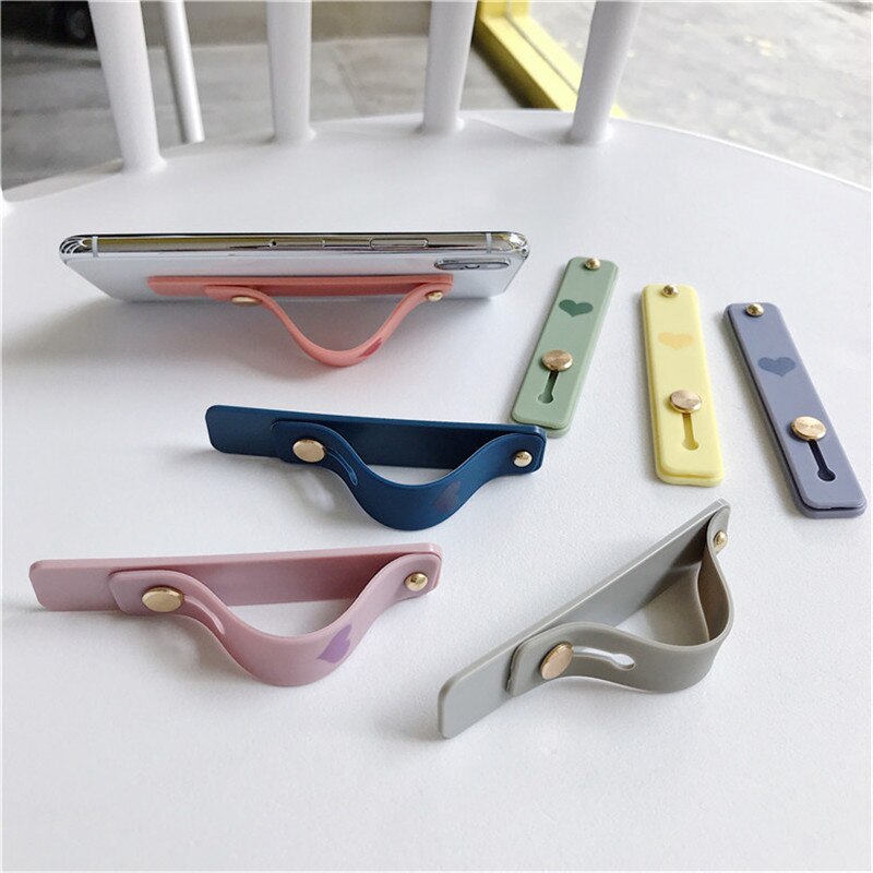 1 pz Candy color cuore custodia per cellulare staffa supporto per cinturino da polso push stretch cinturino da polso in silicone supporto per impugnatura per dito