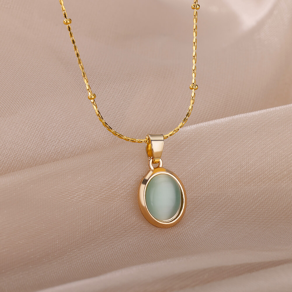 Ovale ketting met opaalsteen voor dames, gemaakt van roestvrij staal met een gouden ovale stenen hanger, ideaal voor een bruiloft.