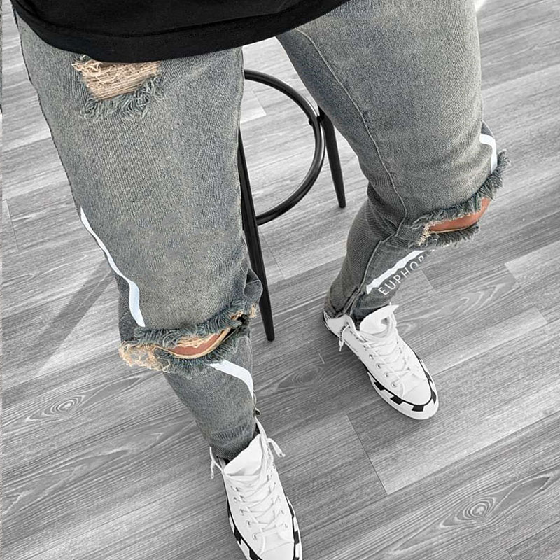 jeans strappati sexy scava fuori uomo moda lettera stampa ginocchio foro nappa jeans attillati strappati Homme pantaloni da jogging casuale in denim