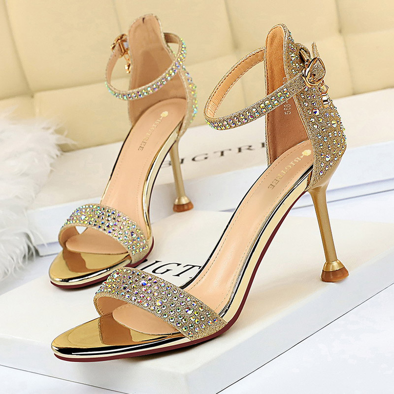 Sandalias de verano para mujer, tacones altos de 8,5 cm, tacones medios de cristal con diamantes de imitación, sandalias con tiras en el tobillo, zapatos dorados para y evento de boda