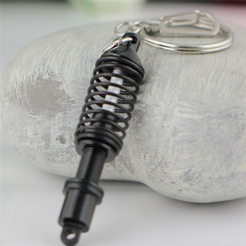 Ajustable a estrenar Cool colorido Metal útil llavero primavera coche pieza de amortiguador llavero aleación: Black