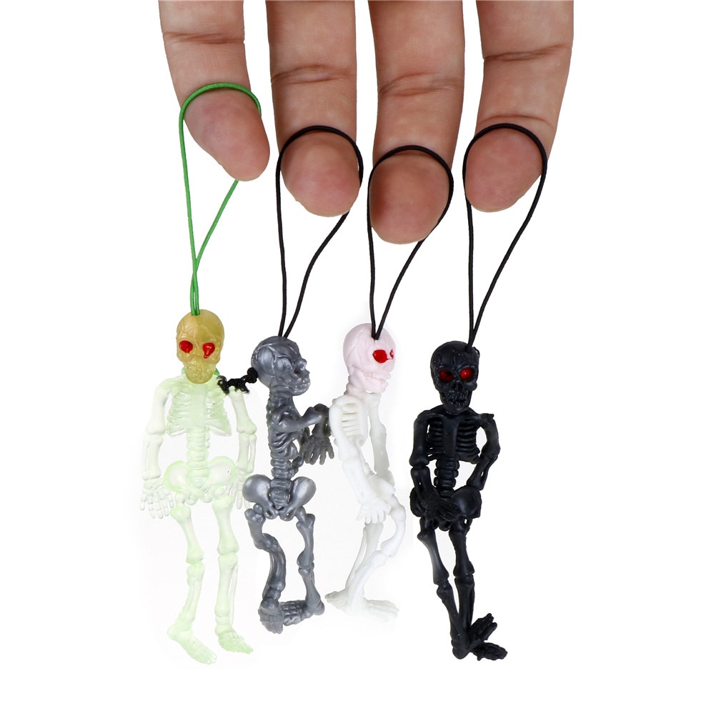 2 pz/lotto di Gomma scaryskull giocattoli mini Luminoso incandescenza in il buio Scheletro Appeso Decorazione