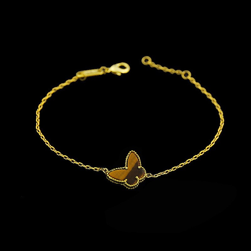 Guldfarvet sommerfuglearmbånd til kvinder