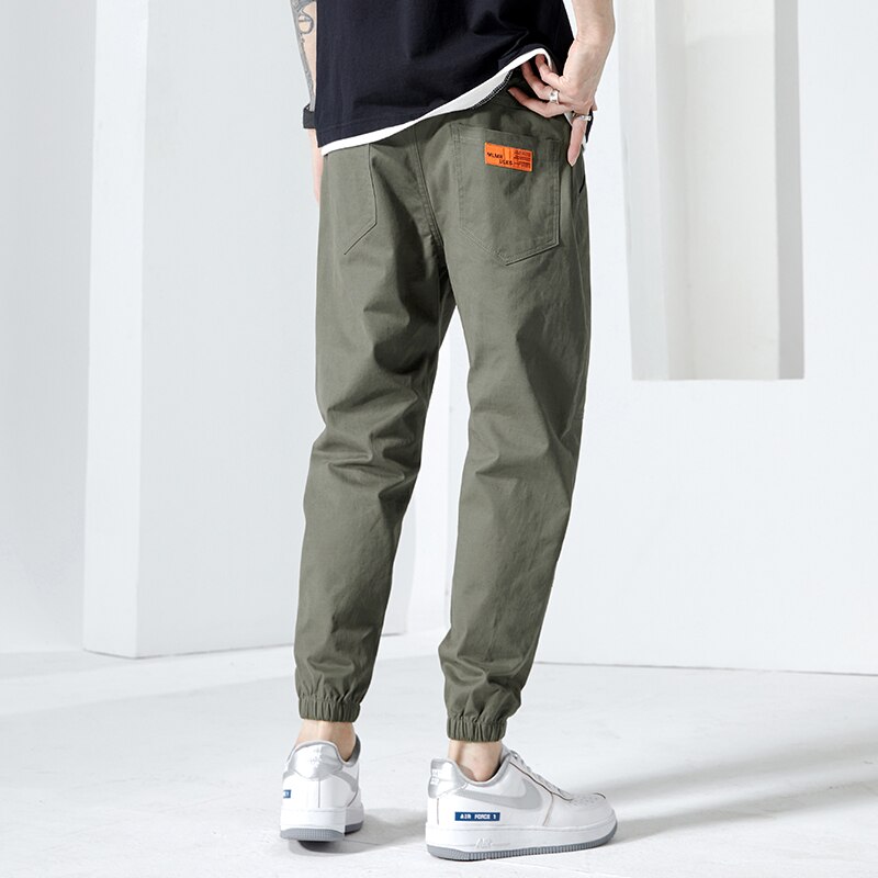 Moda Off White Casual Harem Pants męskie spodnie do biegania męskie Slim japońska moda uliczna kieszonkowe aplikacje Casual spodnie Harajuku