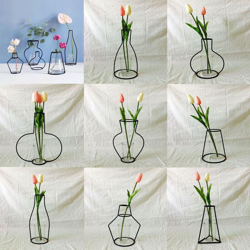 Svart blomstervase grytehengende jernstativ uten glasspynt kontorinnredning