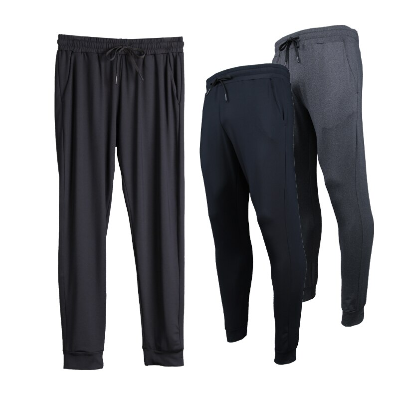 Pantalons longs en cours d'exécution hommes Polyester mince Sport entraînement Joggers poches solides pantalons de survêtement Compression hommes pantalons décontractés