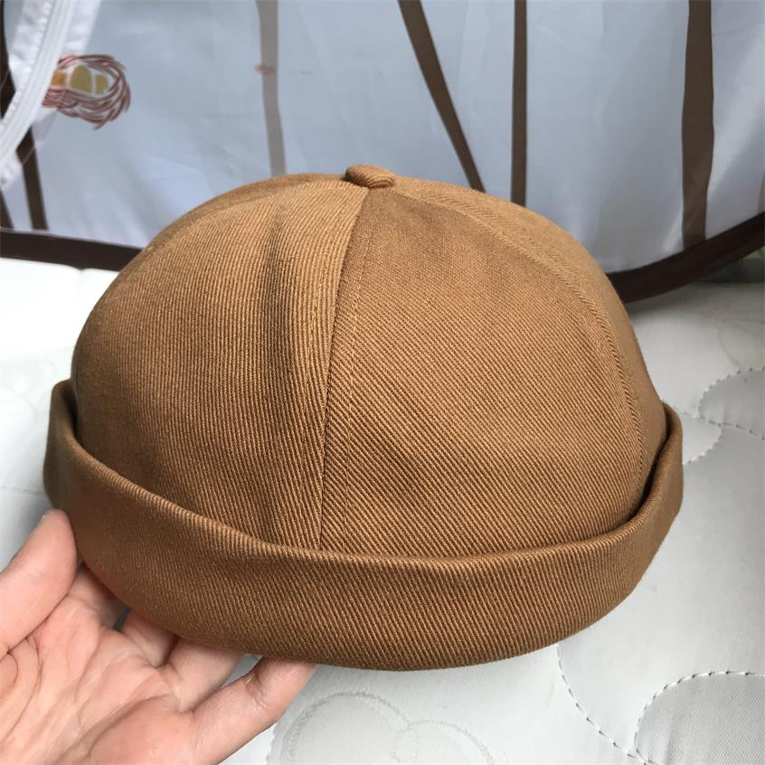 Kiinteä kiristysnyöri pipo reunaton lippalakki vintage retro leon satama satamalaituri hattu rullattu ranneke kallo merimies pyöräilijä lippikset kesä ulkona