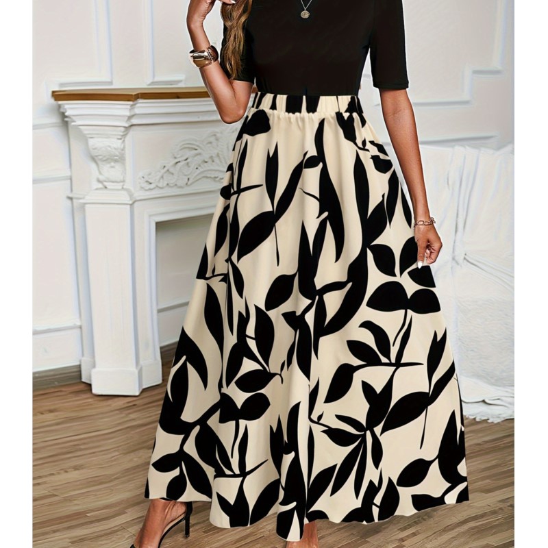 Zwarte rok met bloemenprint voor dames in de herfst, veelzijdige rok met elastische taille, soepelvallende stof en plooien.