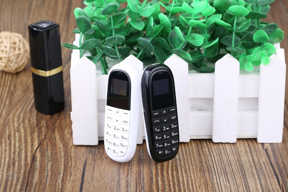 Mini mobile phone AEKU KK1 0.66 inch small screen bluetooth Dialer Russian keyboard Magic Voice PK GT GTstar BM70 BM50