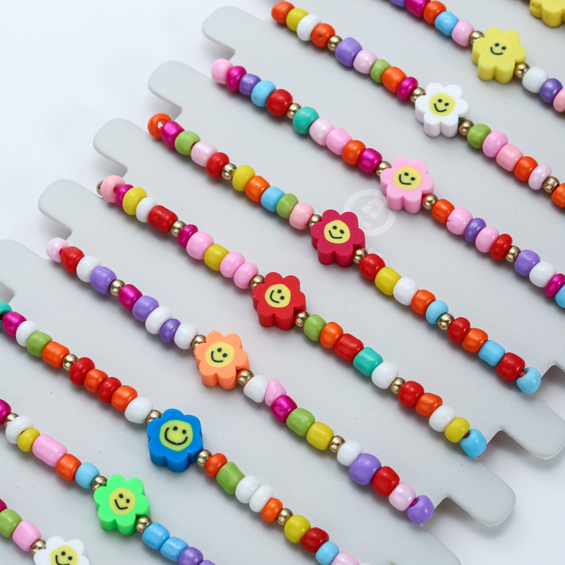 Conjunto de pulsera trenzada con cuentas para mujer y niño, brazalete de cuerda ajustable con abalorios de flores de concha de colores, 12 Uds./lote