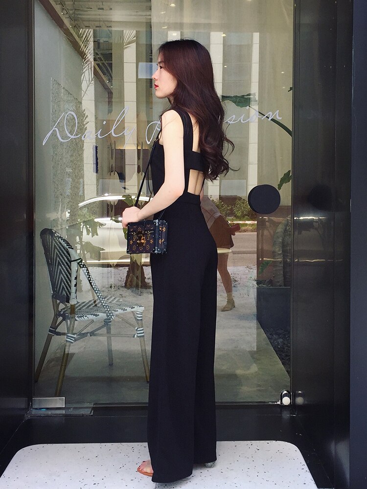 Vår sommar kvinnor svart jumpsuit hög midja öppen rygg baggy långa breda ben jumpsuits casual romper streetwear