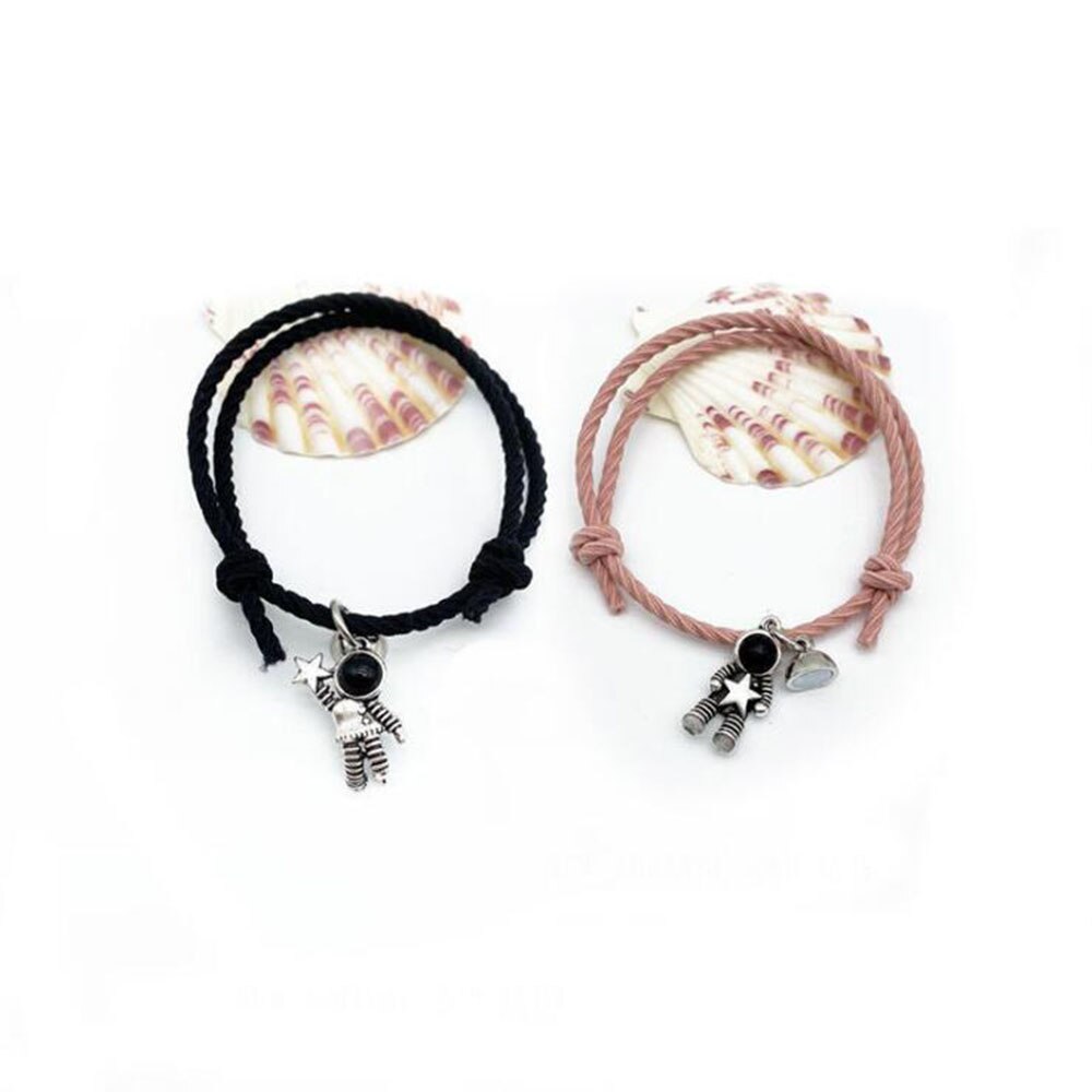 Pulsera de pareja astronauta pequeña banda de Goma para enviar novia novio imán piedra brazalete con cascabel nudo de la cuerda de la joyería: Black Pink
