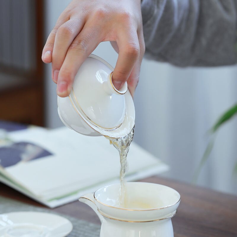 Tueen-cuenco de té de Jade, Taza de cerámica grande con contorno de porcelana blanca en dorado, para infusiones, Kung Fu