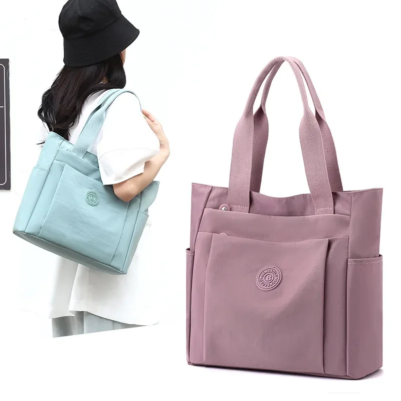Sac décontracté pour femmes, à la et décontracté, nouvel article 2024, sac mère à main en tissu nylon solide de grande capacité à bandoulière unique