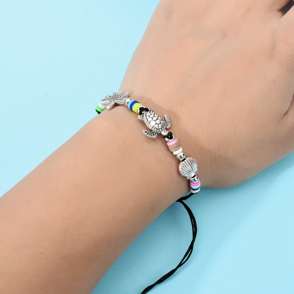 Conjunto de pulseras trenzadas con dijes de elefante para hombre y mujer, pulsera con cadena de cuerda ajustable, estrella de concha, joyería para Yoga, 12 unids/lote