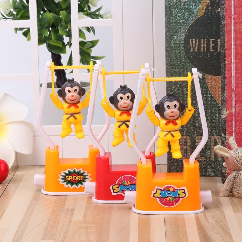 Novedad mono Animal juguetes de gimnasia artísticos dibujos animados viento juguete niños juguete