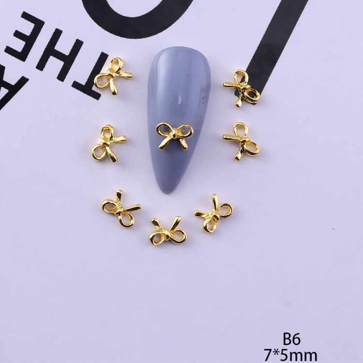 50 pezzi di ciondoli in lega d'oro e d'argento per unghie papillon farfalla 3D multi-forme accessori per unghie per ciondoli gioielli per chiodo arte giapponesi: esercito verde