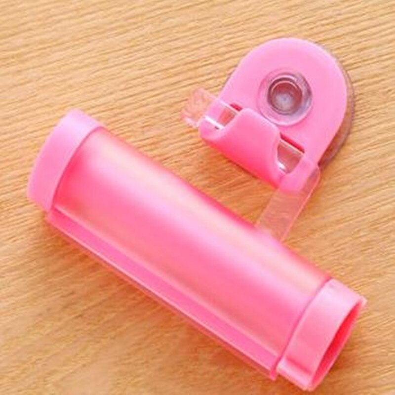 Plastic Rolling Tube Squeezer Toothpaste Dispenser Suction Cup Hook Toothpaste Squeezer Bathroom Accessories: Pink