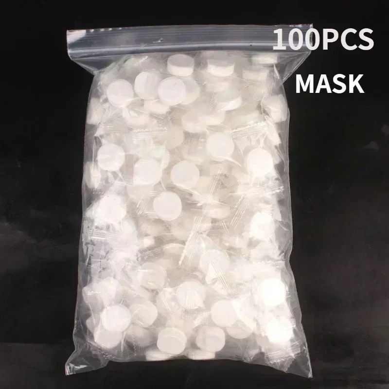 100 st engångs komprimerade ansiktsmasker bärbara resor non-woven ansiktsmasker hudvård bomullsinslagna masker papper