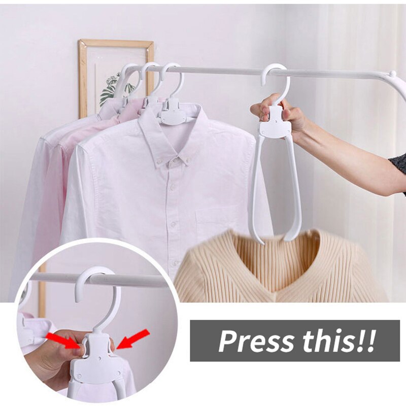 Perchas creativas plegables para almacenaje de ropa y guardarropa organizador de guardarropa percha gruesa de plástico con un botón para encogimiento de ropa
