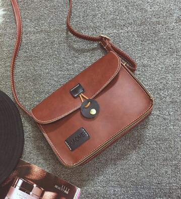 Britse retro postbode tas j de vrouwelijke tas college eenvoudige wind wilde school studenten schoudertas: Bruin