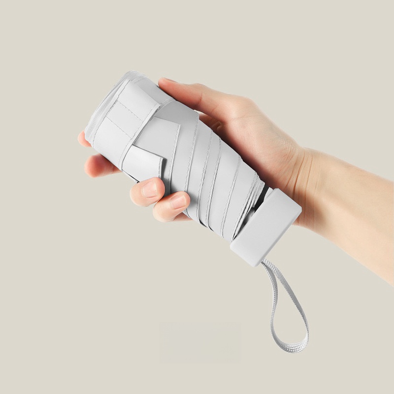 Paraguas de cápsula portátil Mini sombrilla protector solar paraguas de lluvia mango de aleación de caucho negro plegable sol lluvia doble uso cápsula Umb: Blanco