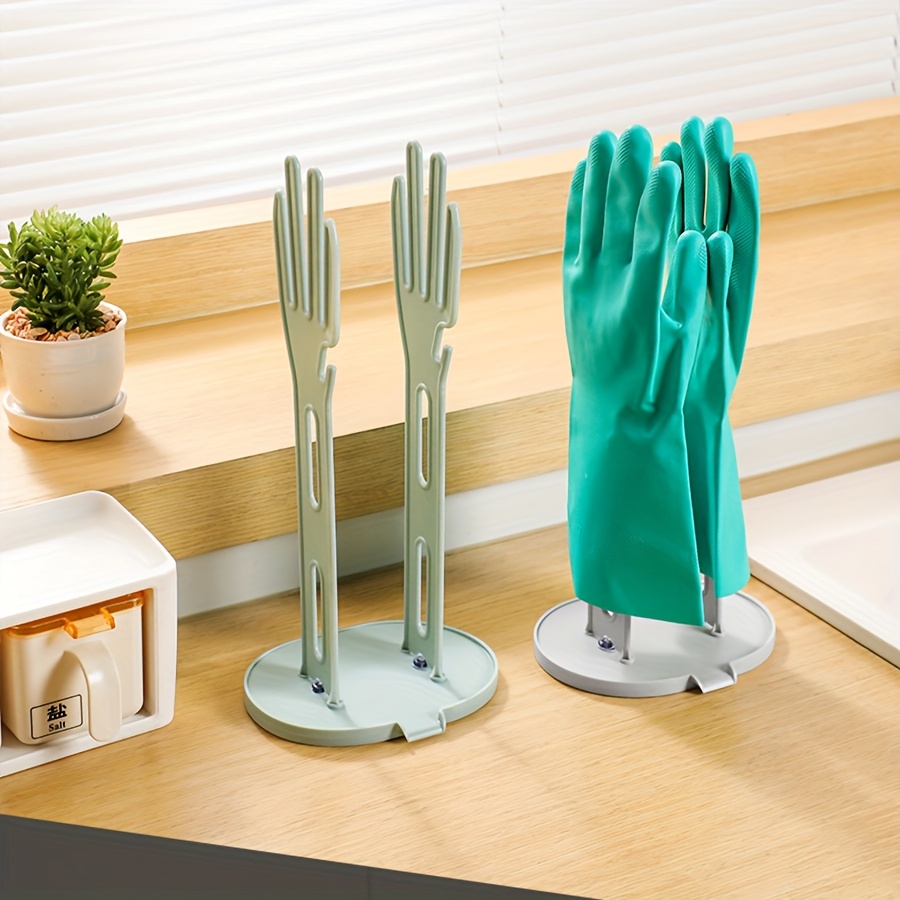 Een droogrek voor rubberen keukenhandschoenen, een houder voor handschoenen en een opbergrek voor handdoeken in de keuken en badkamer.