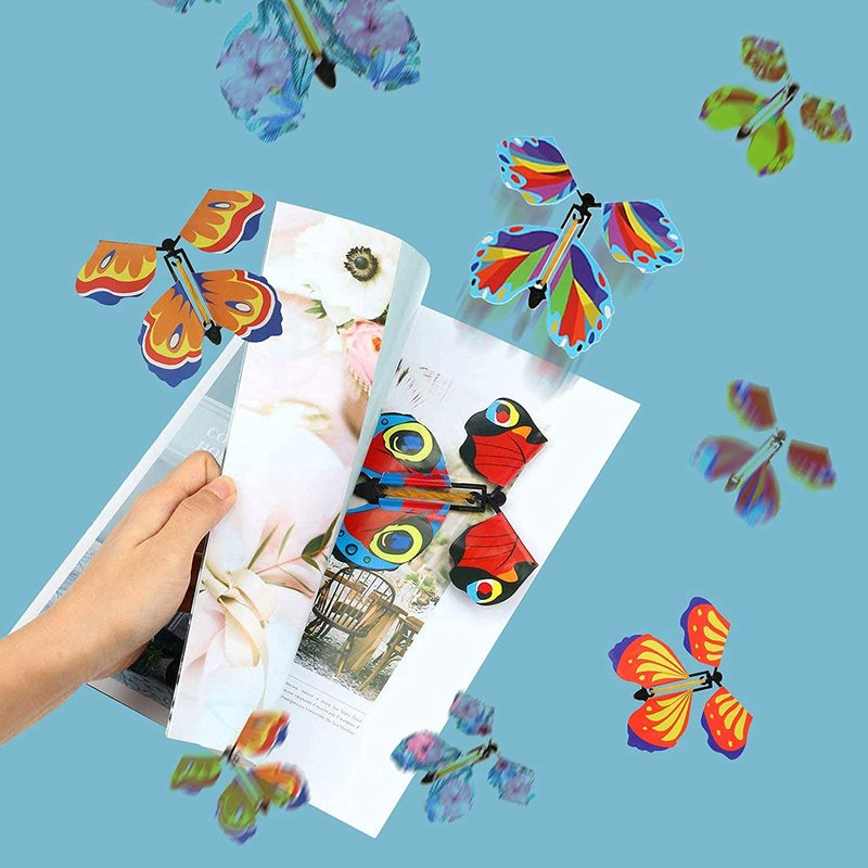 Mariposas voladoras mágicas, juguete de cuerda en el cielo, marcapáginas, tarjetas de felicitación, banda de goma alimentada, accesorios mágicos para niños, sorpresa