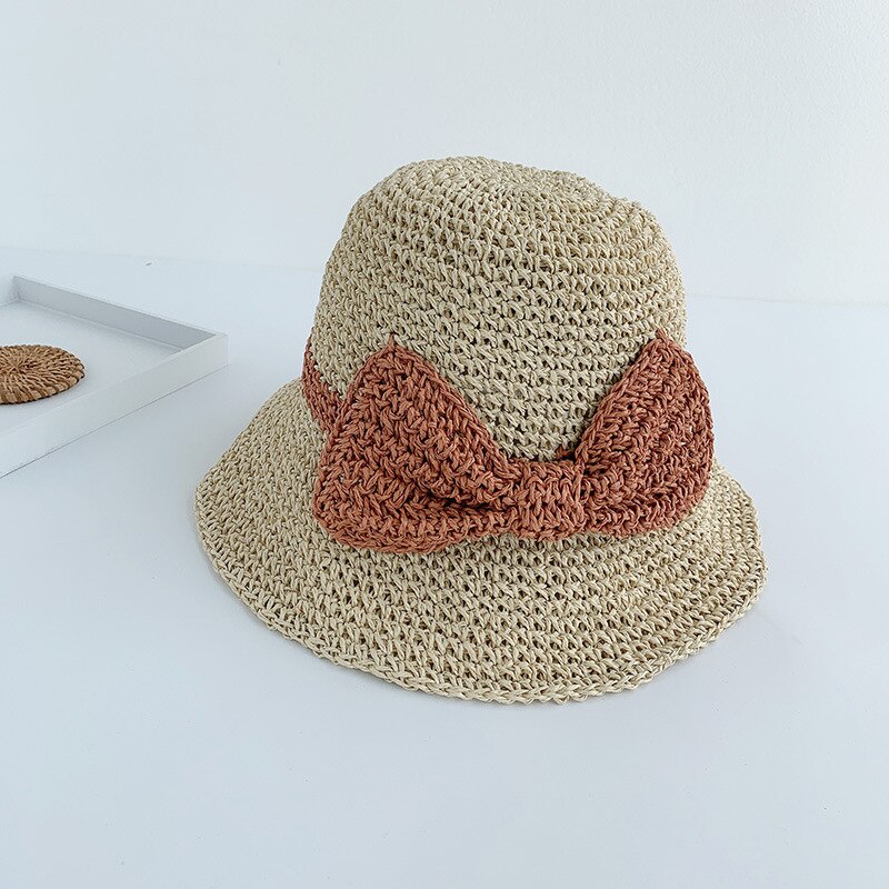 Japansk stråhatt kvinnlig sommarhit färg rosett knut handgjord halm ihålig fiskarhatt strandsolskydd hatt hinkhatt: Beige