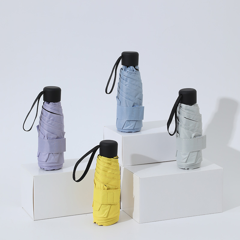 Mini paraguas plegable ultraligero de bolsillo para mujer, paraguas plegable pequeño a prueba de viento para viaje, paraguas compacto para lluvia para hombre, paraguas protector solar para exteriores