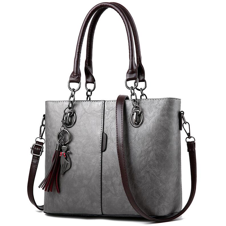 Yogodlns mujer de invierno bolsos de mano de cuero de color con borla y borla colgante de gato: Gray