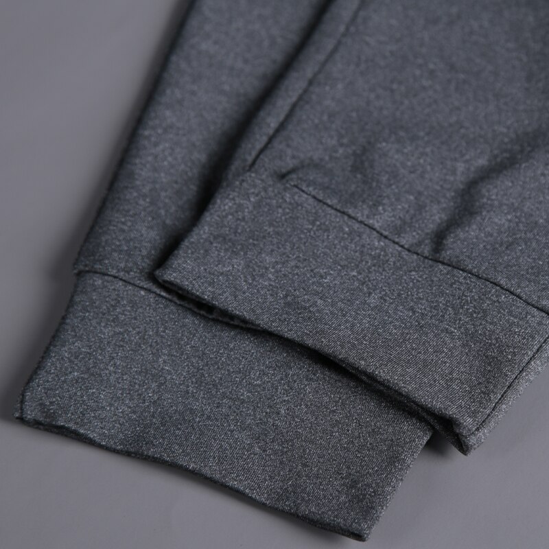 Pantalons longs en cours d'exécution hommes Polyester mince Sport entraînement Joggers poches solides pantalons de survêtement Compression hommes pantalons décontractés