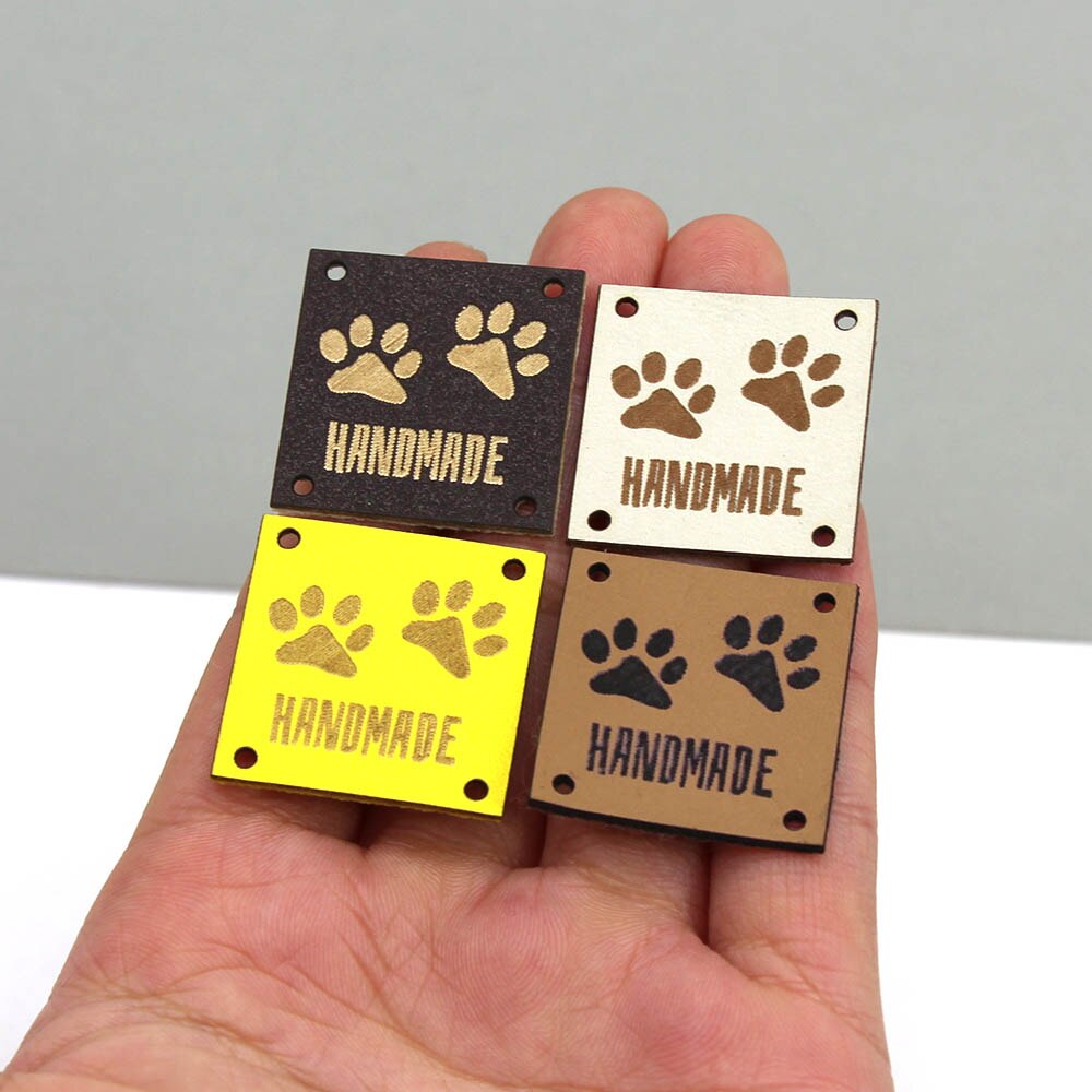 Etiquetas de cuero con huellas de animales, etiquetas hechas a mano para ropa, perro, gato, oso, pata, etiqueta hecha a mano para coser sombreros DIY, 20 piezas, 25x25mm