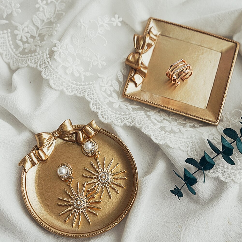 Retro still life photography, photo studio prop, golden vintage plate, dish with bow knot for jewelry, earrings, photography
