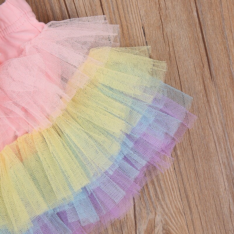 Härlig nyfödd flicka elastisk midja paljetter rosett tutu lager bodysuit kjol pannband 2 st prinsesstjejer regnbågskläder