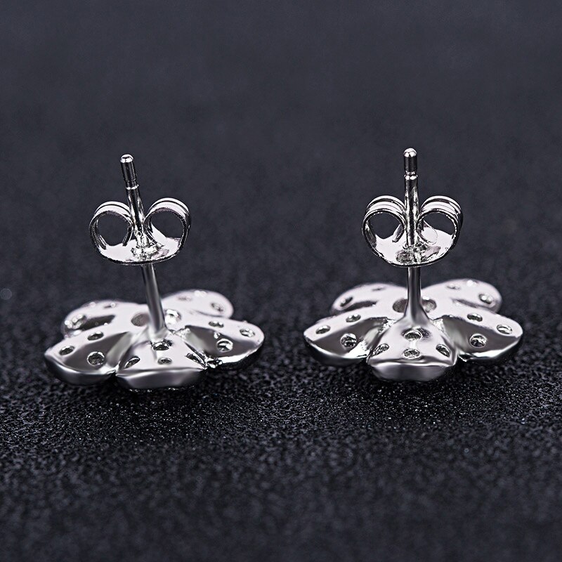 Huitan-pendientes de planta romántica para niña, con forma de flor pequeña Simple con forma de flor, aretes de tuerca de circón cúbico blanco rosa claro