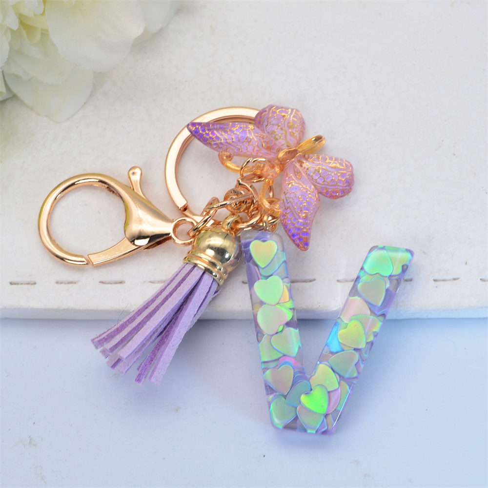 Exquisito llavero de resina brillante azul con 26 iniciales, llavero con colgante de borla de mariposa púrpura con letra de A a Z para mujeres y hombres, para parejas: Multicolor