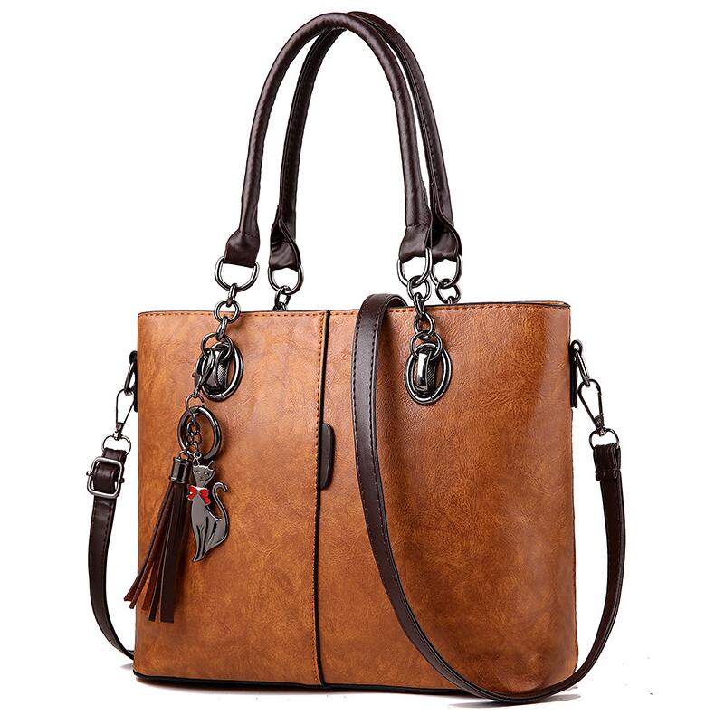 Yogodlns mujer de invierno bolsos de mano de cuero de color con borla y borla colgante de gato: Brown