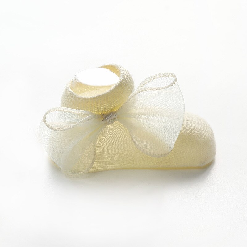Antislip sokken voor baby's met strik, voor peuters, pasgeborenen, antislip sokken voor meisjes en jongens, effen kleur: Geel / S 6-12 maanden
