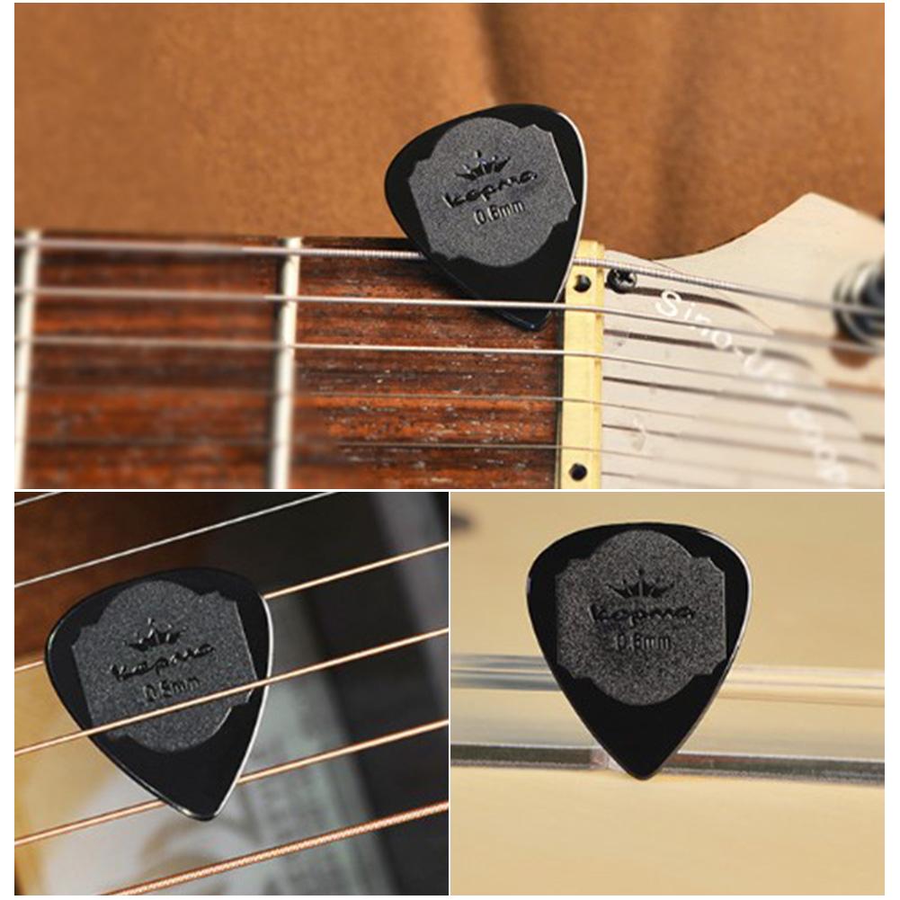 Púa de Guitarra antideslizante, 5 uds., mediador de nailon blanco y negro para Guitarra eléctrica acústica, ukelele de 0,6 MM, accesorios