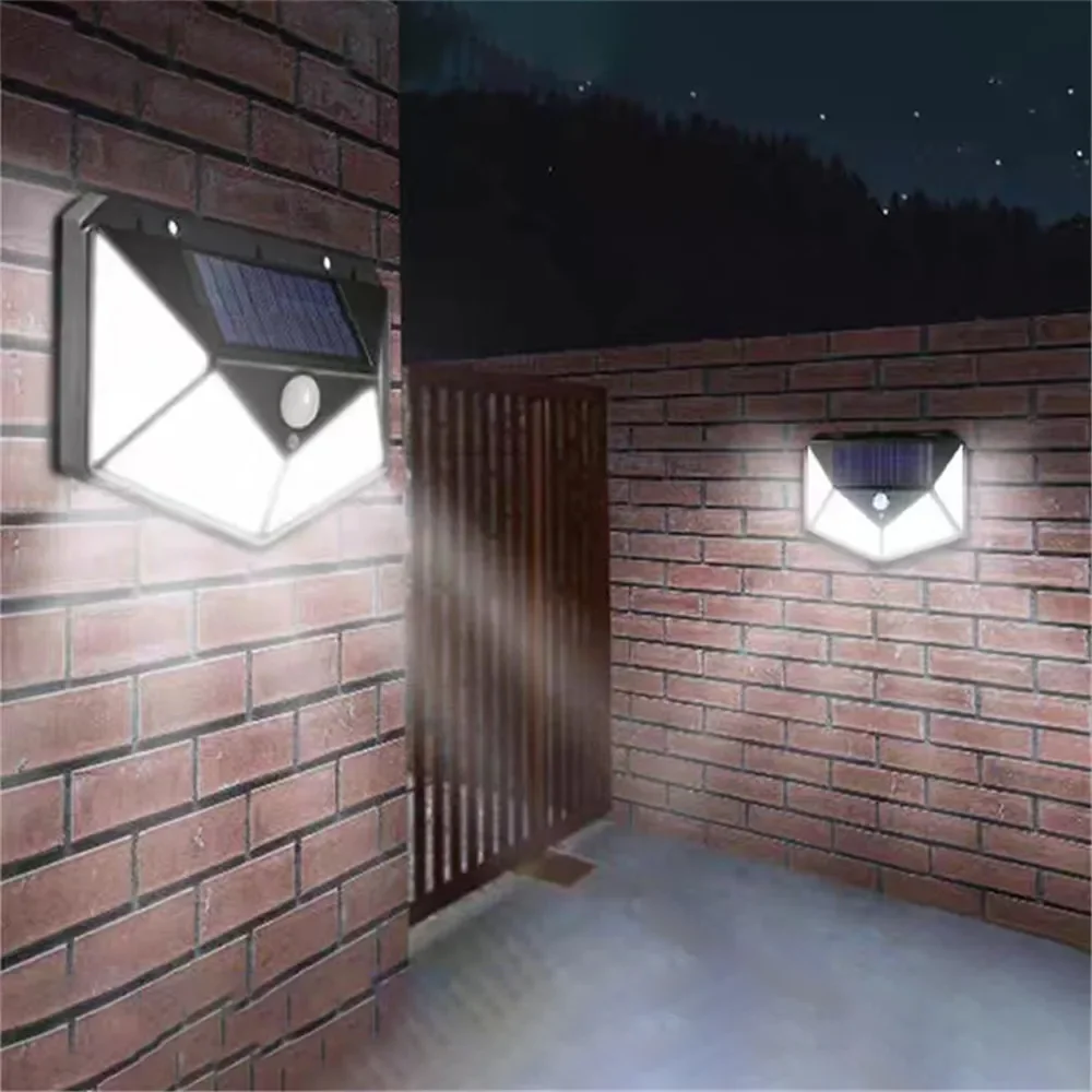 Nyeste solcellelamper udendørs 100 led solcellesensor bevægelseslys 3 tilstande udendørs solcelle trådløs lampe  ip65 vandtætte væglamper