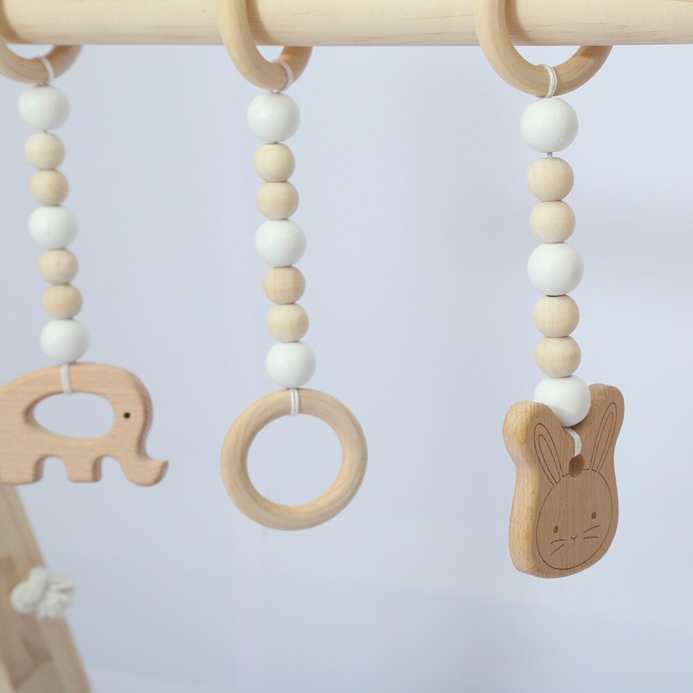 Nordisk babyværelse indretning lege motionscenter legetøj træ børnehave sanselegetøj spædbarnsværelse tøjstativ tilbehør fotografering rekvisitter