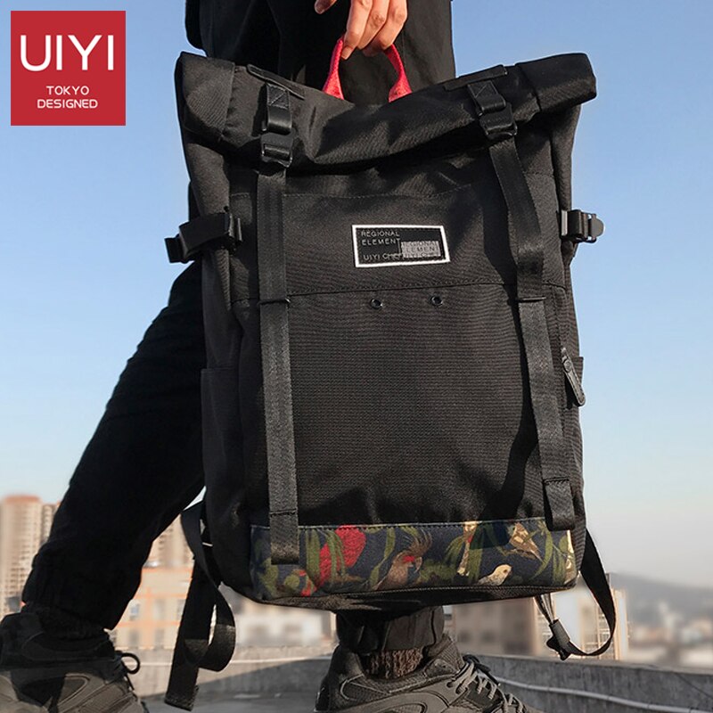 UIYI marca Coreana tampa do rolo de 15 polegada de viagem saco de escola mochila de esportes casuais saco dos homens laptop mochila mochilas à prova d' água