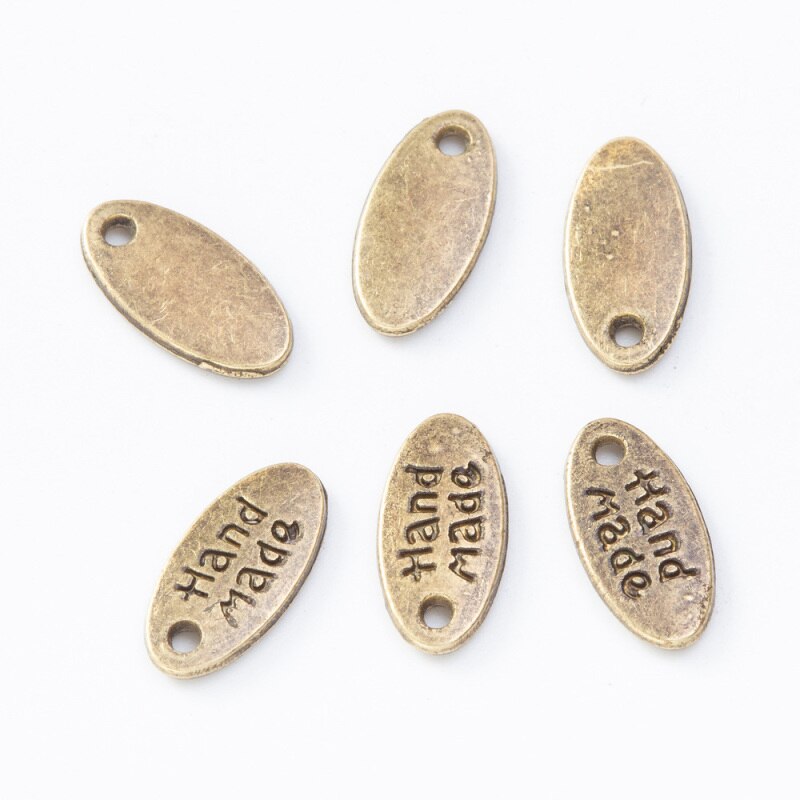 Etiquetas de Metal con patrón de letras hechas a mano, para coser bolsas de ropa, decoración, accesorios colgantes joyas DIY, 50 Uds.: 1