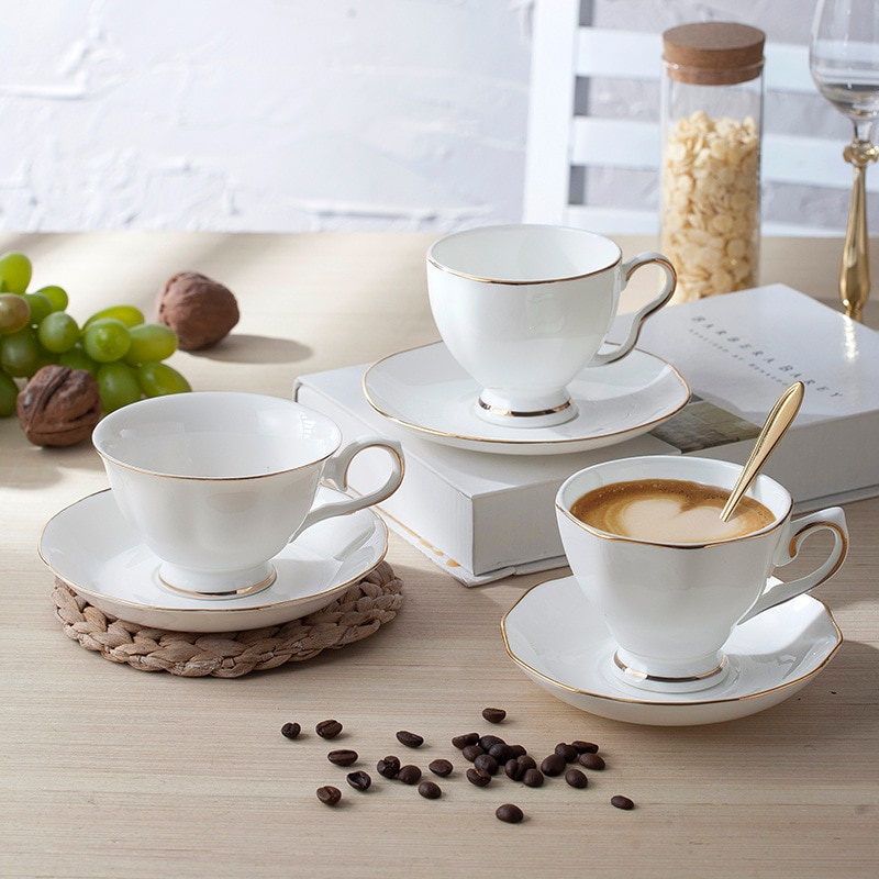 Style européen supérieur ivoire blanc en céramique os chine porcelaine Drinkware service à café avec soucoupe tasse et cuillère Rose doré