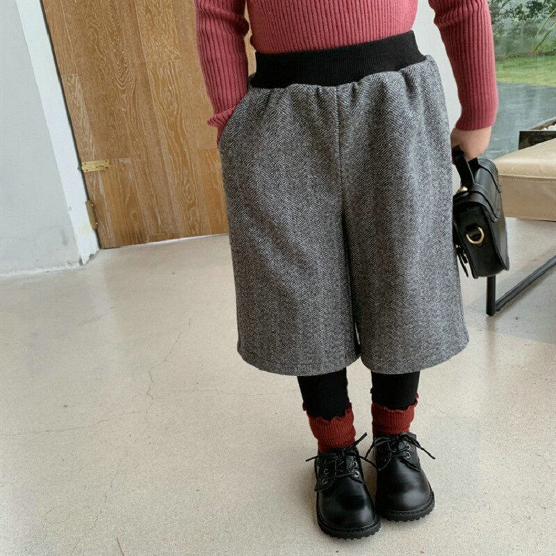 Spodnie dziecięce fałszywe dwuczęściowe wełniane oraz aksamitne grube spodnie 2020 zimowe ubrania nowe modne ubrania Gilrs w stylu brytyjskim